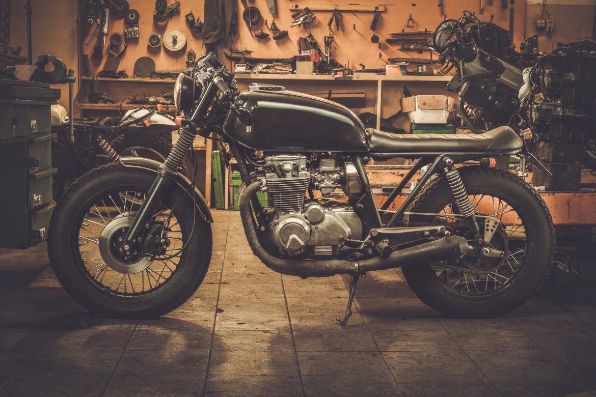 Vintage style cafe-racer motorcycle in customs garage How Can I Make More Space in My Garage?